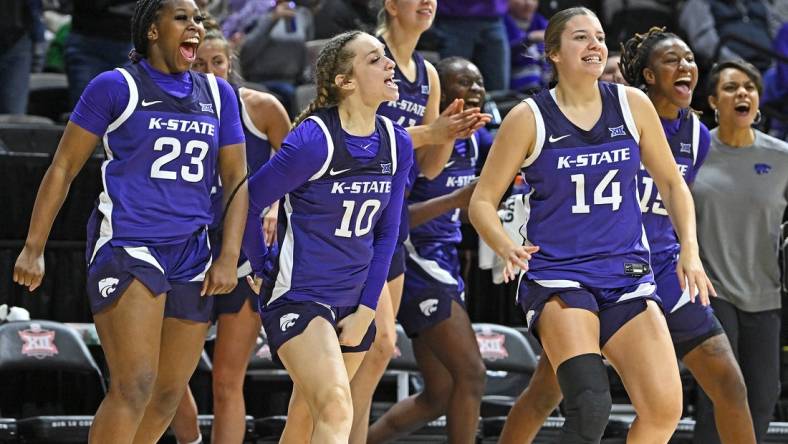 Mar 10, 2023; Kansas City, MO, USA;  Kansas State Wildcats guard Mimi Gatewood (23), Mikayla Parks (10) and Rebekah Dallinger (14) reacts after a Wildcat score during the first half against the Texas Longhorns at Municipal Auditorium. Mandatory Credit: Peter Aiken-USA TODAY Sports