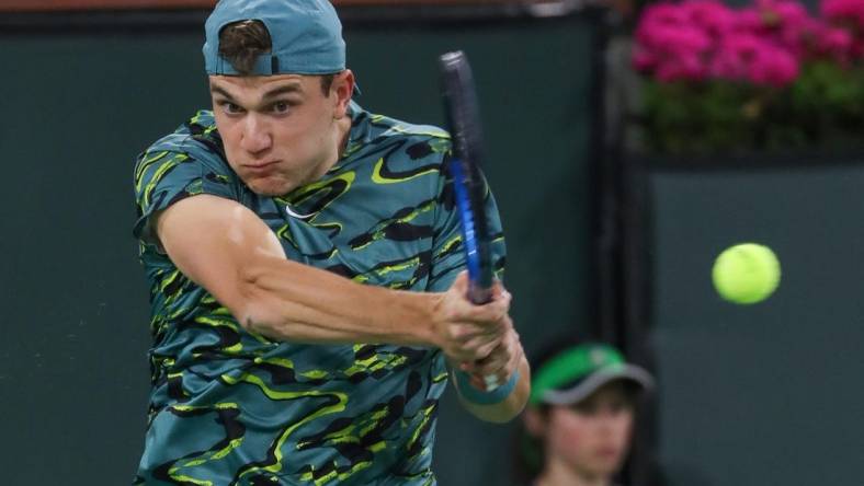 Jack Draper hits a shot during his match against Carlos Alcarez at the BNP Paribas Open in Indian Wells, Calif., March 14, 2023.

Bnp Tuesday 12