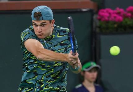 Jack Draper hits a shot during his match against Carlos Alcarez at the BNP Paribas Open in Indian Wells, Calif., March 14, 2023.

Bnp Tuesday 12