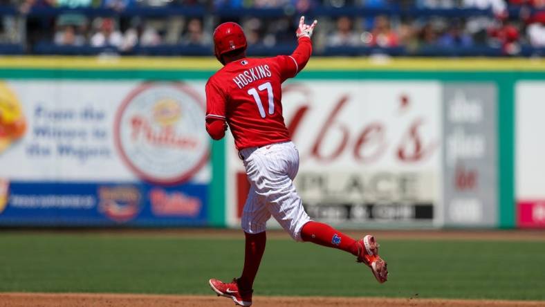 Mar 20, 2023; Clearwater, Florida, USA;  Philadelphia Phillies first baseman Rhys Hoskins (17) rounds the bases after hitting a two-run home run against the Baltimore Orioles in the second inning during spring training at BayCare Ballpark. Mandatory Credit: Nathan Ray Seebeck-USA TODAY Sports