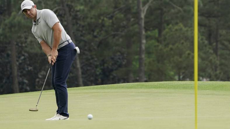 Apr 7, 2023; Augusta, Georgia, USA; Rory McIlroy putts on no. 18 during the second round of The Masters golf tournament. Mandatory Credit: Katie Goodale USA TODAY Network