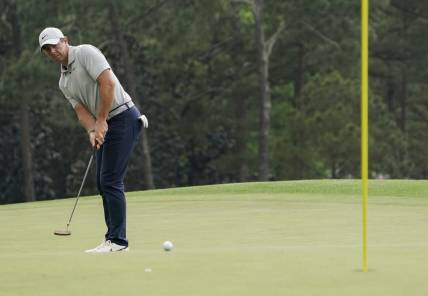 Apr 7, 2023; Augusta, Georgia, USA; Rory McIlroy putts on no. 18 during the second round of The Masters golf tournament. Mandatory Credit: Katie Goodale USA TODAY Network