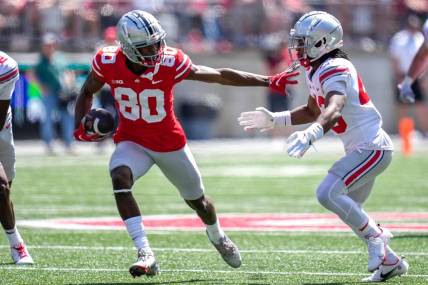 Apr 15, 2023; Columbus, Ohio, United States;  Ohio State Buckeyes wide receiver Noah Rogers (80) evades Ohio State Buckeyes cornerback Diante Griffin (43) during the fourth quarter of the Ohio State Buckeyes spring game at Ohio Stadium on Saturday morning. Mandatory Credit: Joseph Scheller-The Columbus Dispatch

Football Ceb Osufb Spring Game Ohio State At Ohio State