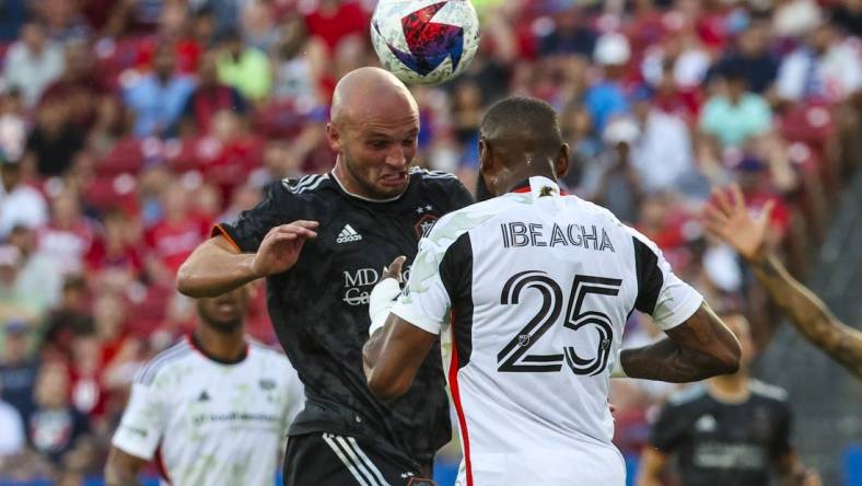 May 20, 2023; Frisco, Texas, USA; Houston Dynamo defender Chase Gasper (30) heads the ball in front of FC Dallas defender Sebastien Ibeagha (25) during the first half at Toyota Stadium. Mandatory Credit: Kevin Jairaj-USA TODAY Sports