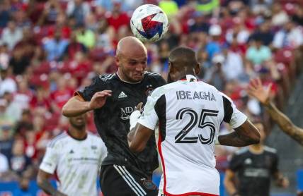 May 20, 2023; Frisco, Texas, USA; Houston Dynamo defender Chase Gasper (30) heads the ball in front of FC Dallas defender Sebastien Ibeagha (25) during the first half at Toyota Stadium. Mandatory Credit: Kevin Jairaj-USA TODAY Sports