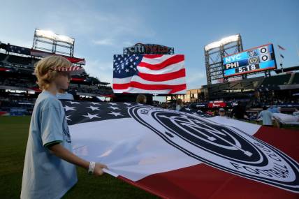 May 27, 2023; Flushing, New York, USA; A young fan holds a banner during the national anthem before a match between New York City FC and the Philadelphia Union at Citi Field. Mandatory Credit: Brad Penner-USA TODAY Sports