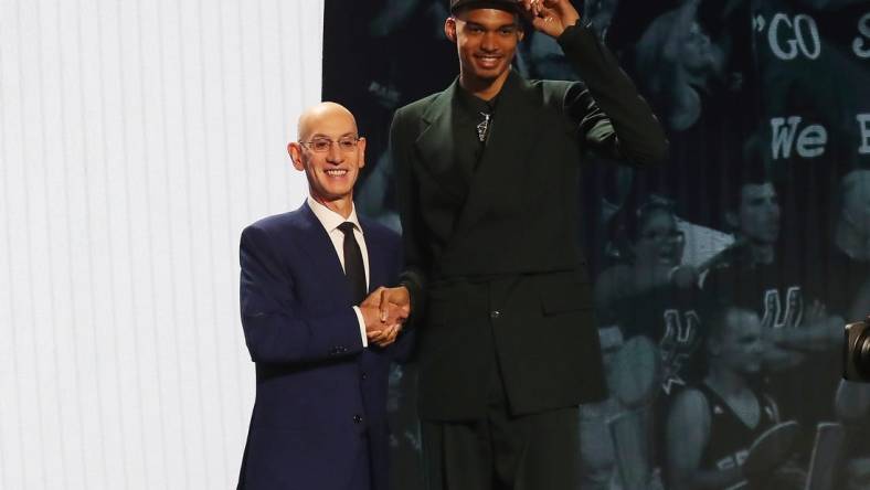 Jun 22, 2023; Brooklyn, NY, USA; Victor Wembanyama poses for photos with NBA commissioner Adam Silver after being selected first by the San Antonio Spurs in the first round of the 2023 NBA Draft at Barclays Arena. Mandatory Credit: Wendell Cruz-USA TODAY Sports