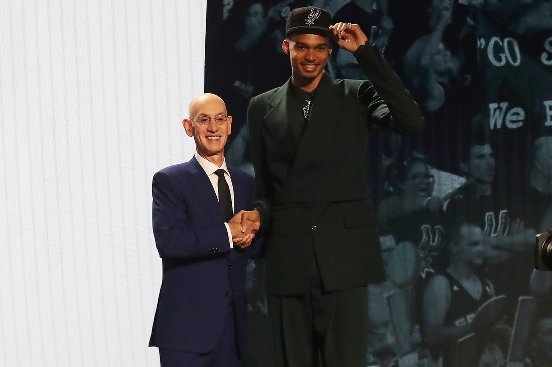 Jun 22, 2023; Brooklyn, NY, USA; Victor Wembanyama poses for photos with NBA commissioner Adam Silver after being selected first by the San Antonio Spurs in the first round of the 2023 NBA Draft at Barclays Arena. Mandatory Credit: Wendell Cruz-USA TODAY Sports