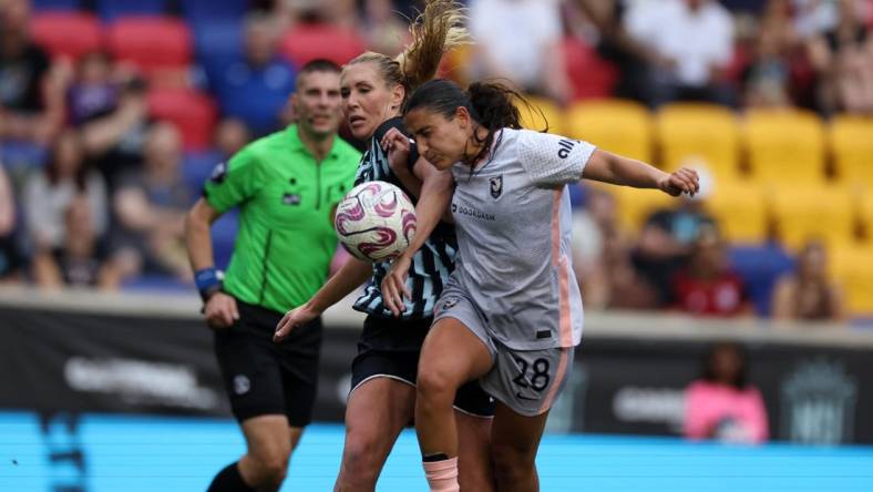 Jul 2, 2023; Harrison, New Jersey, USA; Angel City FC midfielder Lily Nabet (28) goes for the ball during the second half against New Jersey/New York Gotham FC midfielder Allie Long (6) at Red Bull Arena. Mandatory Credit: Vincent Carchietta-USA TODAY Sports