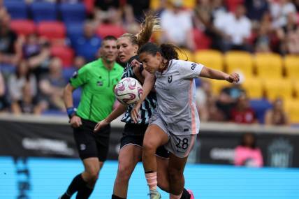 Jul 2, 2023; Harrison, New Jersey, USA; Angel City FC midfielder Lily Nabet (28) goes for the ball during the second half against New Jersey/New York Gotham FC midfielder Allie Long (6) at Red Bull Arena. Mandatory Credit: Vincent Carchietta-USA TODAY Sports