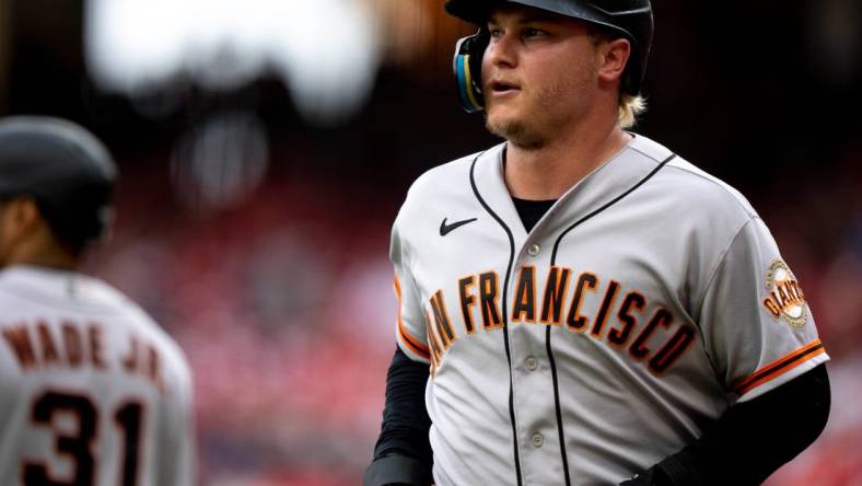 San Francisco Giants designated hitter Joc Pederson (23) smiles after scoring a run in the tenth inning of the MLB baseball game between the Cincinnati Reds and San Francisco Giants at Great American Ball Park in Cincinnati on Tuesday, July 18, 2023. This was during a continuation of yesterdays game which was suspended after a long rain delay.