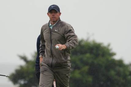 Jul 23, 2023; Hoylake, England, GBR; Rory McIlroy acknowledges the crowd after a putt on the 13th green during the final round of The Open Championship golf tournament. Mandatory Credit: Kyle Terada-USA TODAY Sports