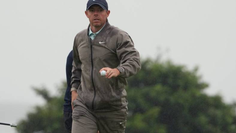 Jul 23, 2023; Hoylake, England, GBR; Rory McIlroy acknowledges the crowd after a putt on the 13th green during the final round of The Open Championship golf tournament. Mandatory Credit: Kyle Terada-USA TODAY Sports