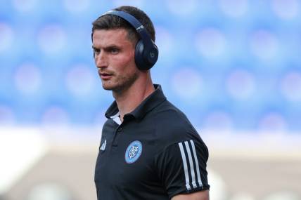 Jul 26, 2023; Harrison, NJ, USA; New York City FC goalkeeper Cody Mizell (25) with beats wireless headphones on the pitch before the match against Toronto FC at Red Bull Arena. Mandatory Credit: Vincent Carchietta-USA TODAY Sports