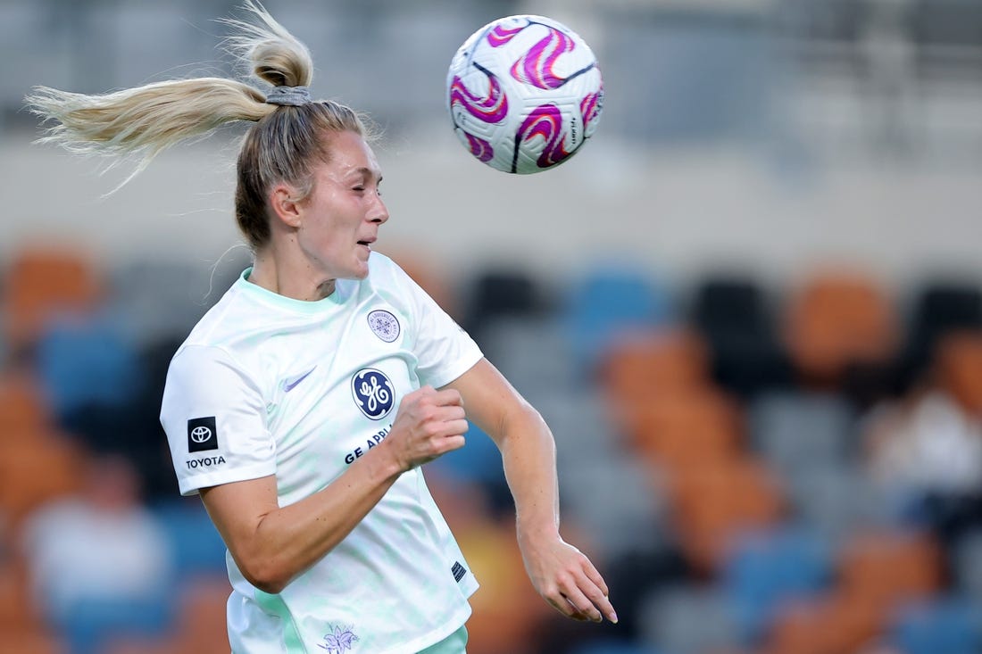 Jul 29, 2023; Houston, TX, USA; Racing Louisville FC forward Parker Goins (21) heads the ball against the Houston Dash during the first half at Shell Energy Stadium. Mandatory Credit: Erik Williams-USA TODAY Sports