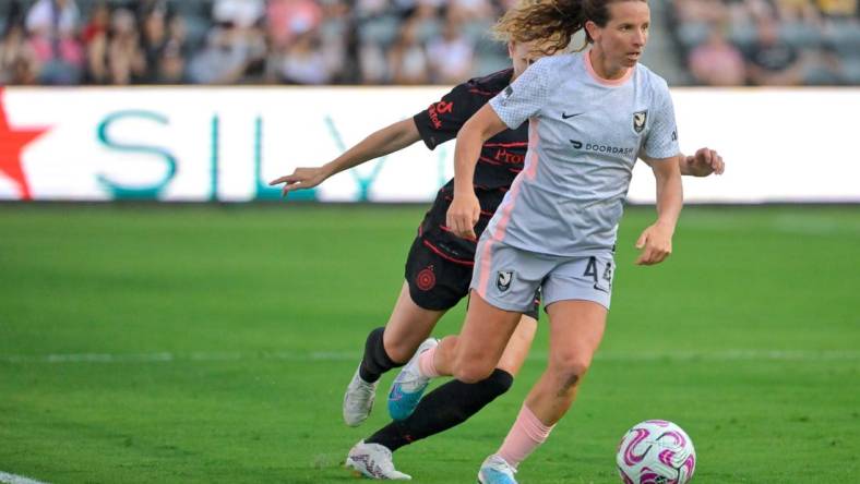 Jul 29, 2023; Los Angeles, CA, USA;  Angel City FC defender Elizabeth Eddy (44) dribbles the ball against Portland Thorns FC defender Natalia Kuikka (14) in the first half at BMO Stadium. Mandatory Credit: Jayne Kamin-Oncea-USA TODAY Sports