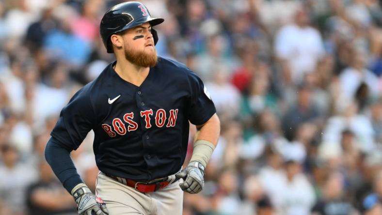 Aug 1, 2023; Seattle, Washington, USA; Boston Red Sox second baseman Christian Arroyo (39) runs toward first base after hitting a two run RBI double against the Seattle Mariners during the fourth inning at T-Mobile Park. Mandatory Credit: Steven Bisig-USA TODAY Sports