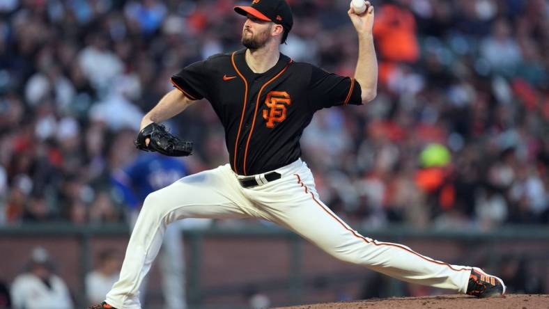 Aug 12, 2023; San Francisco, California, USA; San Francisco Giants starting pitcher Alex Wood (57) throws a pitch against the Texas Rangers during the sixth inning at Oracle Park. Mandatory Credit: Darren Yamashita-USA TODAY Sports