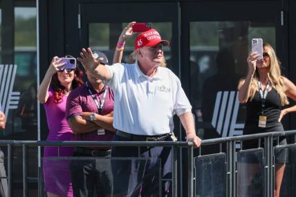 Aug 13, 2023; Bedminster, New Jersey, USA; Former President Donald Trump waves to the fans during the final round of the LIV Golf Bedminster golf tournament at Trump National Bedminster. Mandatory Credit: Vincent Carchietta-USA TODAY Sports