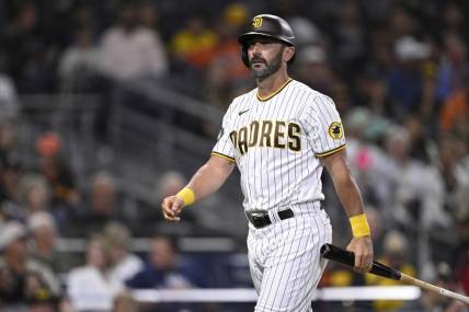 Aug 15, 2023; San Diego, California, USA; San Diego Padres pinch hitter Matt Carpenter (14) walks to the dugout after striking out during the seventh inning against the Baltimore Orioles at Petco Park. Mandatory Credit: Orlando Ramirez-USA TODAY Sports