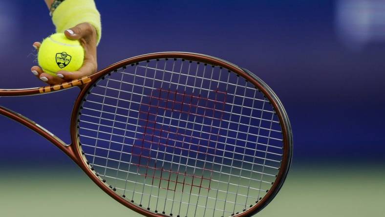 Aug 18, 2023; Mason, OH, USA; A detail view of the ball as Ons Jabeur (TUN) prepares to serve against Aryna Sabalenka during the Western and Southern Open tennis tournament at Lindner Family Tennis Center. Mandatory Credit: Katie Stratman-USA TODAY Sports