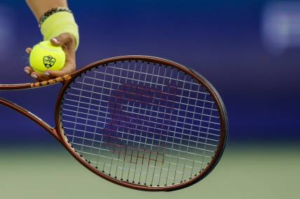 Aug 18, 2023; Mason, OH, USA; A detail view of the ball as Ons Jabeur (TUN) prepares to serve against Aryna Sabalenka during the Western and Southern Open tennis tournament at Lindner Family Tennis Center. Mandatory Credit: Katie Stratman-USA TODAY Sports