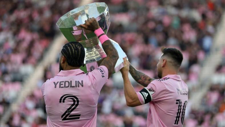 Aug 30, 2023; Fort Lauderdale, Florida, USA; Inter Miami defender DeAndre Yedlin (2) and forward Lionel Messi (10)  hoist the Leagues Cup trophy before the game against Nashville SC at DRV PNK Stadium. Mandatory Credit: Sam Navarro-USA TODAY Sports