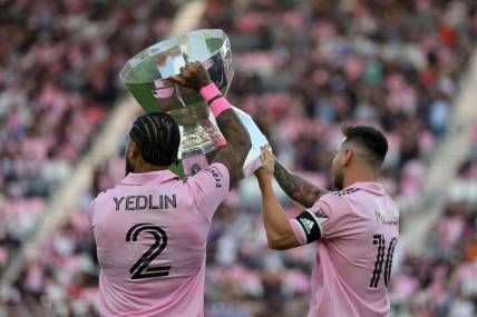 Aug 30, 2023; Fort Lauderdale, Florida, USA; Inter Miami defender DeAndre Yedlin (2) and forward Lionel Messi (10)  hoist the Leagues Cup trophy before the game against Nashville SC at DRV PNK Stadium. Mandatory Credit: Sam Navarro-USA TODAY Sports