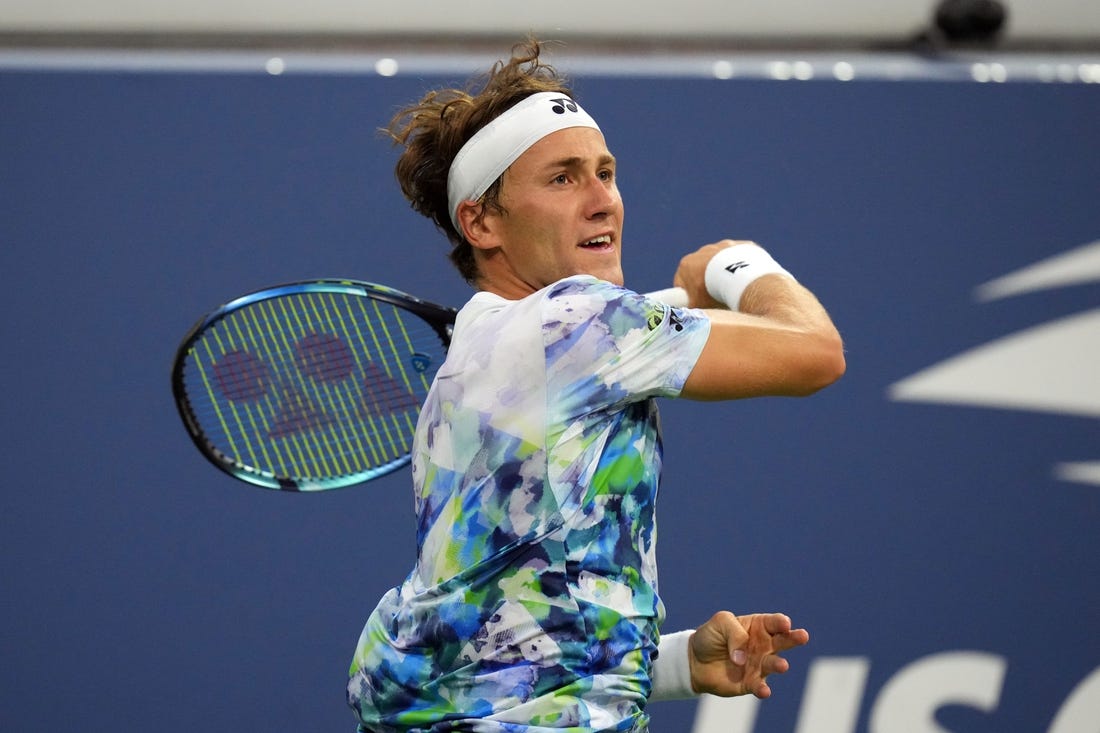 Aug 30, 2023; Flushing, NY, USA; Casper Ruud of Norway hits to Zhizhen Zhang of China on day three of the 2023 U.S. Open Tennis Championships at USTA Billie Jean King National Tennis Center. Mandatory Credit: Danielle Parhizkaran-USA TODAY Sports