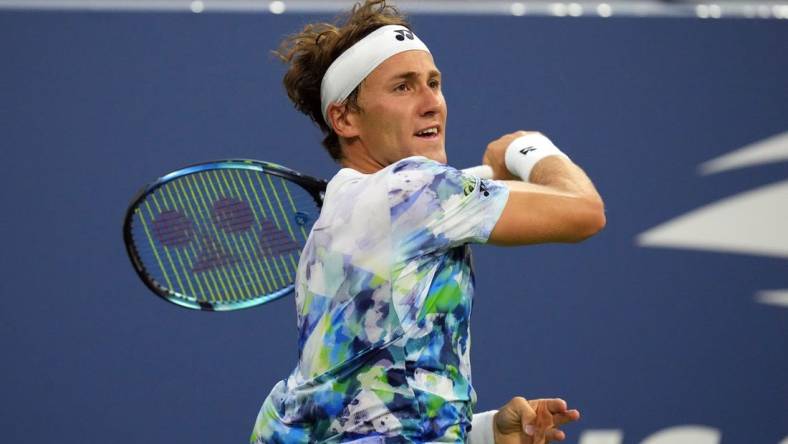 Aug 30, 2023; Flushing, NY, USA; Casper Ruud of Norway hits to Zhizhen Zhang of China on day three of the 2023 U.S. Open Tennis Championships at USTA Billie Jean King National Tennis Center. Mandatory Credit: Danielle Parhizkaran-USA TODAY Sports