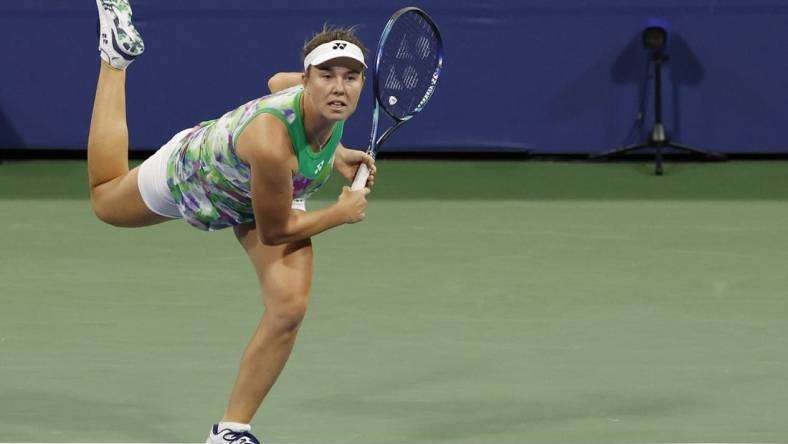 Aug 31, 2023; Flushing, NY, USA; Linda Noskova of the Czech Republic serves against Ons Jabeur of Tunisia (not pictured) on day four of the 2023 U.S. Open tennis tournament at USTA Billie Jean King National Tennis Center. Mandatory Credit: Geoff Burke-USA TODAY Sports