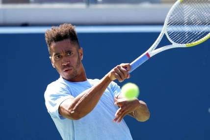 Sep 2, 2023; Flushing, NY, USA; Michael Mmoh of the United States hits to Jack Draper of Great Britain on day six of the 2023 U.S. Open tennis tournament at USTA Billie Jean King National Tennis Center. Mandatory Credit: Danielle Parhizkaran-USA TODAY Sports