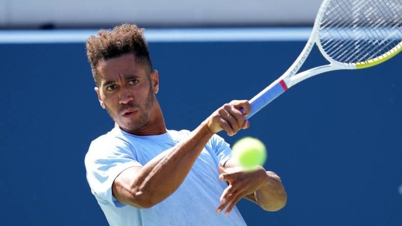 Sep 2, 2023; Flushing, NY, USA; Michael Mmoh of the United States hits to Jack Draper of Great Britain on day six of the 2023 U.S. Open tennis tournament at USTA Billie Jean King National Tennis Center. Mandatory Credit: Danielle Parhizkaran-USA TODAY Sports