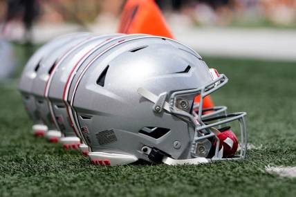 Sep 2, 2023; Bloomington, Indiana, USA; Ohio State Buckeyes helmets sit on the sideline prior to the NCAA football game at Indiana University Memorial Stadium. Ohio State won 23-3.