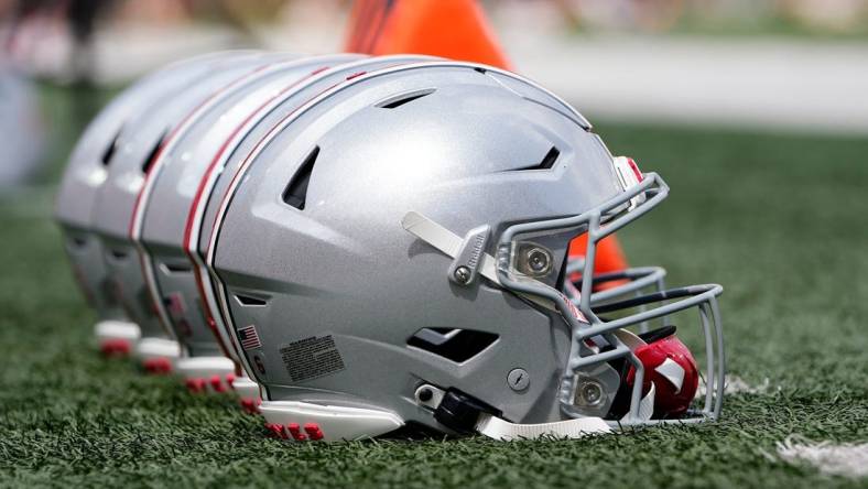 Sep 2, 2023; Bloomington, Indiana, USA; Ohio State Buckeyes helmets sit on the sideline prior to the NCAA football game at Indiana University Memorial Stadium. Ohio State won 23-3.