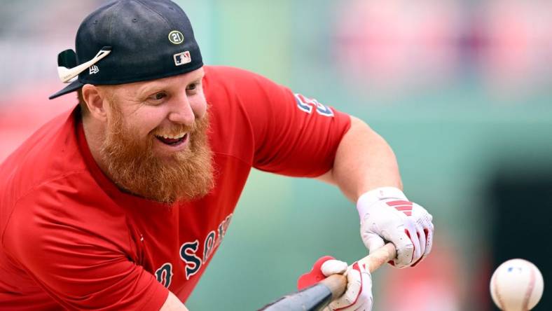 Sep 8, 2023; Boston, Massachusetts, USA; Boston Red Sox designated hitter Justin Turner (2) bunts during batting practice before a game against the Baltimore Orioles at Fenway Park. Mandatory Credit: Brian Fluharty-USA TODAY Sports