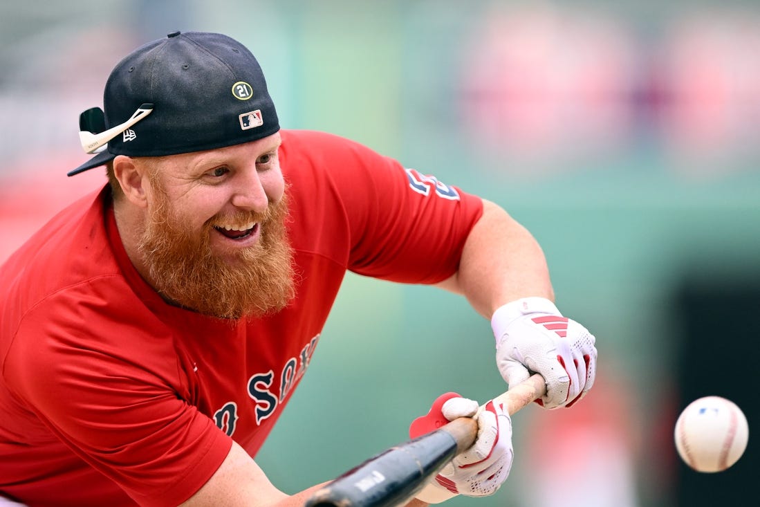 Sep 8, 2023; Boston, Massachusetts, USA; Boston Red Sox designated hitter Justin Turner (2) bunts during batting practice before a game against the Baltimore Orioles at Fenway Park. Mandatory Credit: Brian Fluharty-USA TODAY Sports