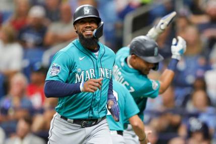 Sep 9, 2023; St. Petersburg, Florida, USA;  Seattle Mariners right fielder Teoscar Hernandez (35) celebrates after scoring a run against the Tampa Bay Rays in the first inning at Tropicana Field. Mandatory Credit: Nathan Ray Seebeck-USA TODAY Sports