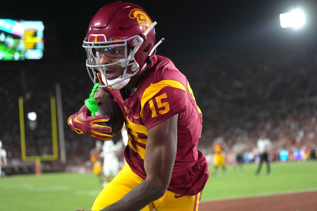 Sep 9, 2023; Los Angeles, California, USA; Southern California Trojans wide receiver Dorian Singer (15) catches a 19-yard touchdown pass against the Stanford Cardinal in the first half at United Airlines Field at Los Angeles Memorial Coliseum. Mandatory Credit: Kirby Lee-USA TODAY Sports