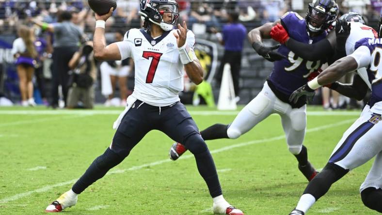 Sep 10, 2023; Baltimore, Maryland, USA; Houston Texans quarterback C.J. Stroud (7) attempts a pass as Baltimore Ravens linebacker Odafe Oweh (99) rushes during the second half at M&T Bank Stadium. Mandatory Credit: Brad Mills-USA TODAY Sports