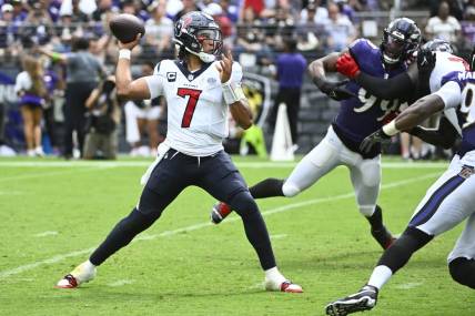 Sep 10, 2023; Baltimore, Maryland, USA; Houston Texans quarterback C.J. Stroud (7) attempts a pass as Baltimore Ravens linebacker Odafe Oweh (99) rushes during the second half at M&T Bank Stadium. Mandatory Credit: Brad Mills-USA TODAY Sports