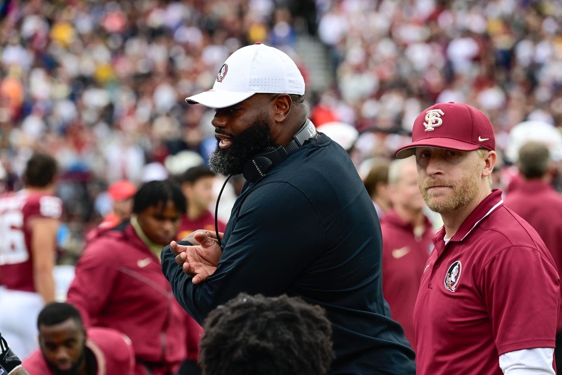 Sep 16, 2023; Chestnut Hill, Massachusetts, USA; Florida State Seminoles offensive coordinator Alex Atkins speaks to the team during the second half against the Boston College Eagles at Alumni Stadium. Mandatory Credit: Eric Canha-USA TODAY Sports