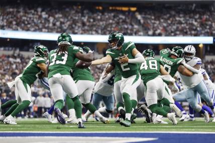 Sep 17, 2023; Arlington, Texas, USA; New York Jets quarterback Zach Wilson (2) hands off to running back Dalvin Cook (33) in the third quarter against the Dallas Cowboys at AT&T Stadium. Mandatory Credit: Tim Heitman-USA TODAY Sports