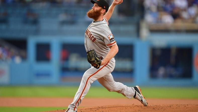 Sep 23, 2023; Los Angeles, California, USA; San Francisco Giants relief pitcher John Brebbia (59) throws against the Los Angeles Dodgers during the first inning at Dodger Stadium. Mandatory Credit: Gary A. Vasquez-USA TODAY Sports