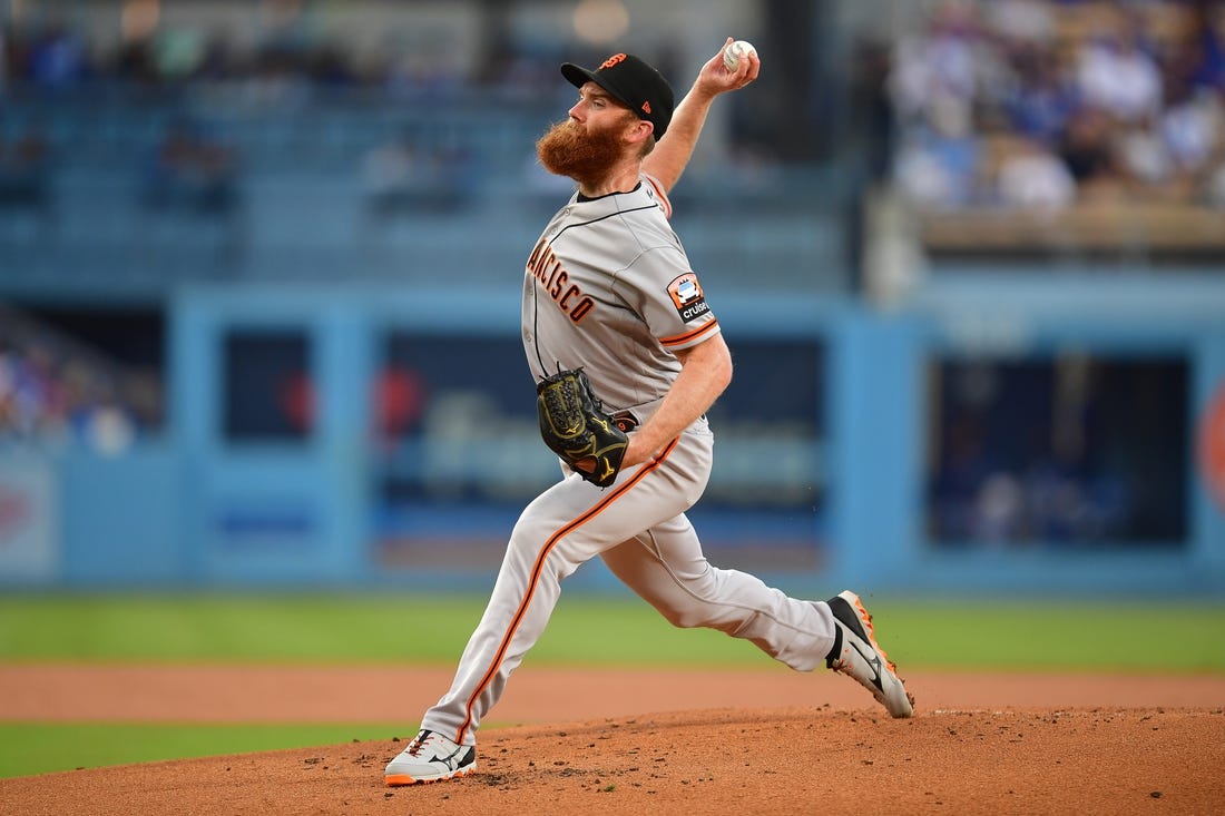 Sep 23, 2023; Los Angeles, California, USA; San Francisco Giants relief pitcher John Brebbia (59) throws against the Los Angeles Dodgers during the first inning at Dodger Stadium. Mandatory Credit: Gary A. Vasquez-USA TODAY Sports