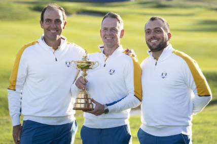 September 26, 2023; Rome, ITALY; (L-R) Team Europe vice-captain Edoardo Molinari, captain Luke Donald, and vice-captain Francesco Molinari pose for a photo with The Ryder Cup trophy during a practice round of the Ryder Cup golf competition at Marco Simone Golf and Country Club. Mandatory Credit: Kyle Terada-USA TODAY Sports