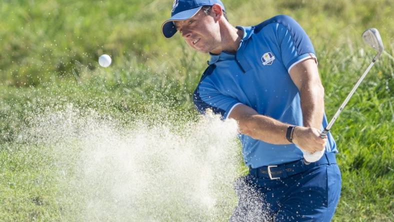 September 27, 2023; Rome, ITA; Team Europe golfer Rory McIlroy hits his bunker shot on the 16th hole during a practice day for the Ryder Cup golf competition at Marco Simone Golf and Country Club. Mandatory Credit: Kyle Terada-USA TODAY Sports