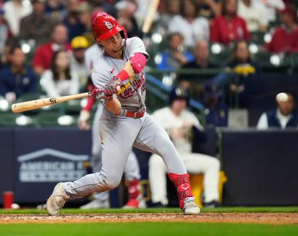 St. Louis Cardinals second baseman Tommy Edman (19) singles on a ground ball to Milwaukee Brewers center fielder Blake Perkins (16) during the fifth inning of the game on Wednesday September 27, 2023 at American Family Field in Milwaukee, Wis.