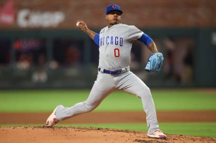 Sep 28, 2023; Atlanta, Georgia, USA; Chicago Cubs starting pitcher Marcus Stroman (0) throws against the Atlanta Braves in the first inning at Truist Park. Mandatory Credit: Brett Davis-USA TODAY Sports