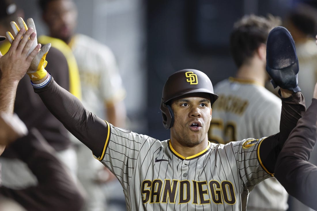 Sep 30, 2023; Chicago, Illinois, USA; San Diego Padres left fielder Juan Soto (22) celebrates with teammates after scoring against the Chicago White Sox during the second inning at Guaranteed Rate Field. Mandatory Credit: Kamil Krzaczynski-USA TODAY Sports